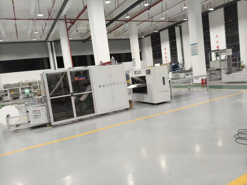 automated filter paper folding and adhesive application machine